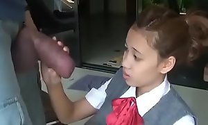 Asian schoolgirl opens yon there suck popular cock
