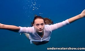 Julia swimming in nature's garb in the sea