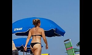 Candid on this little slut at the beach